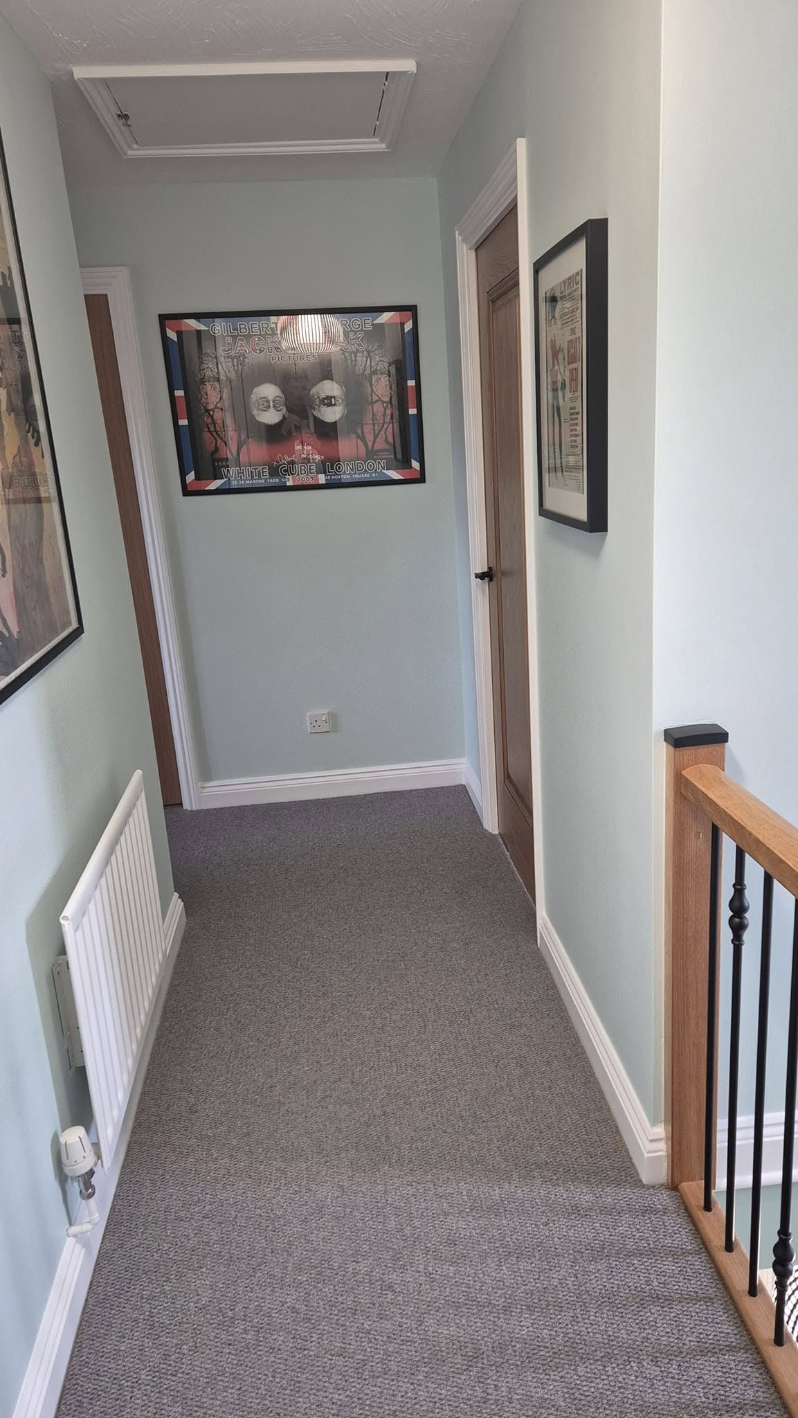 Upstairs landing in pale sage with a white dado rail